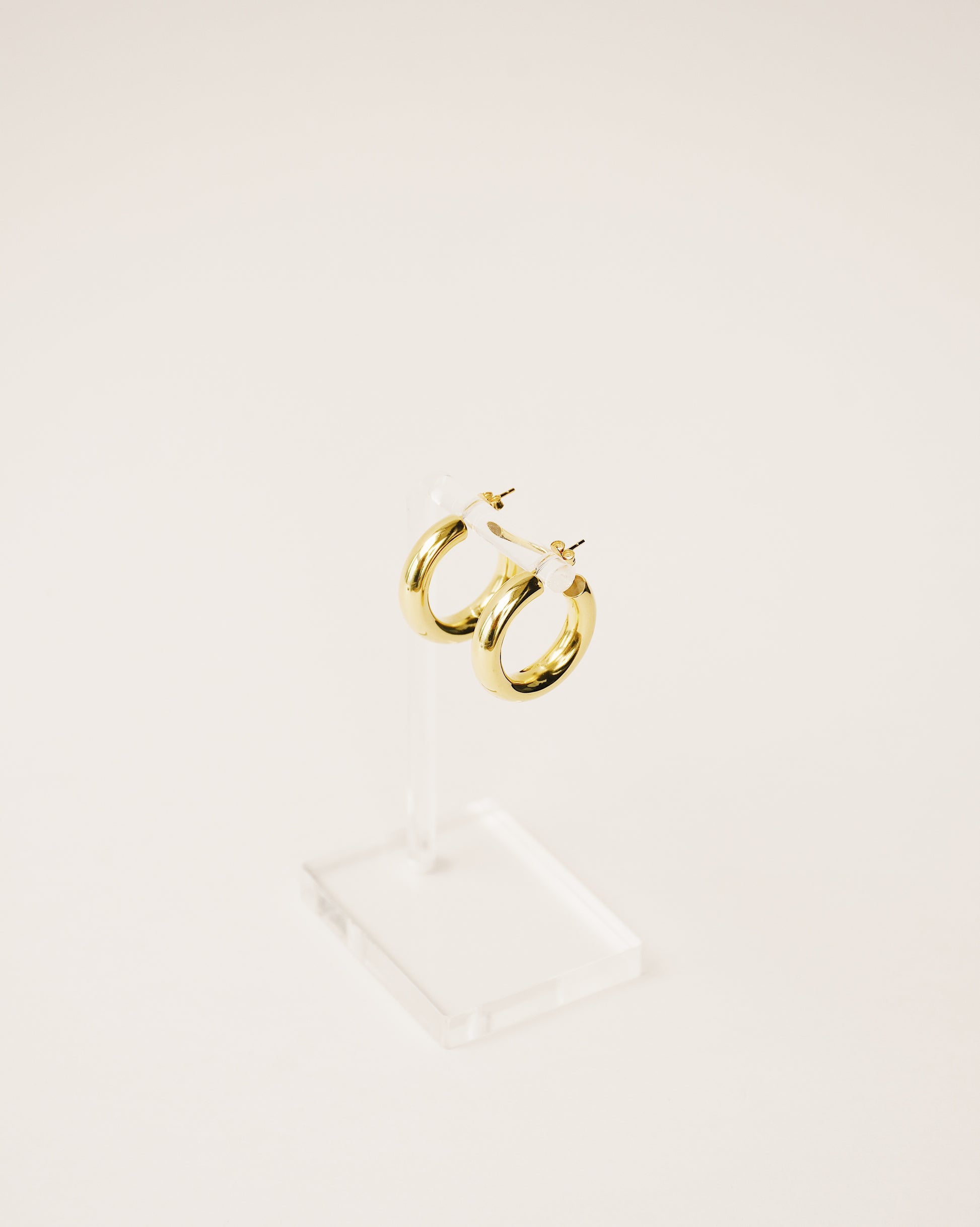 timeless and versatile maxi hoop earrings handcrafted from 925 sterling silver plated in 18k gold. hollow and lightweight. 2020 slow fashion trend.