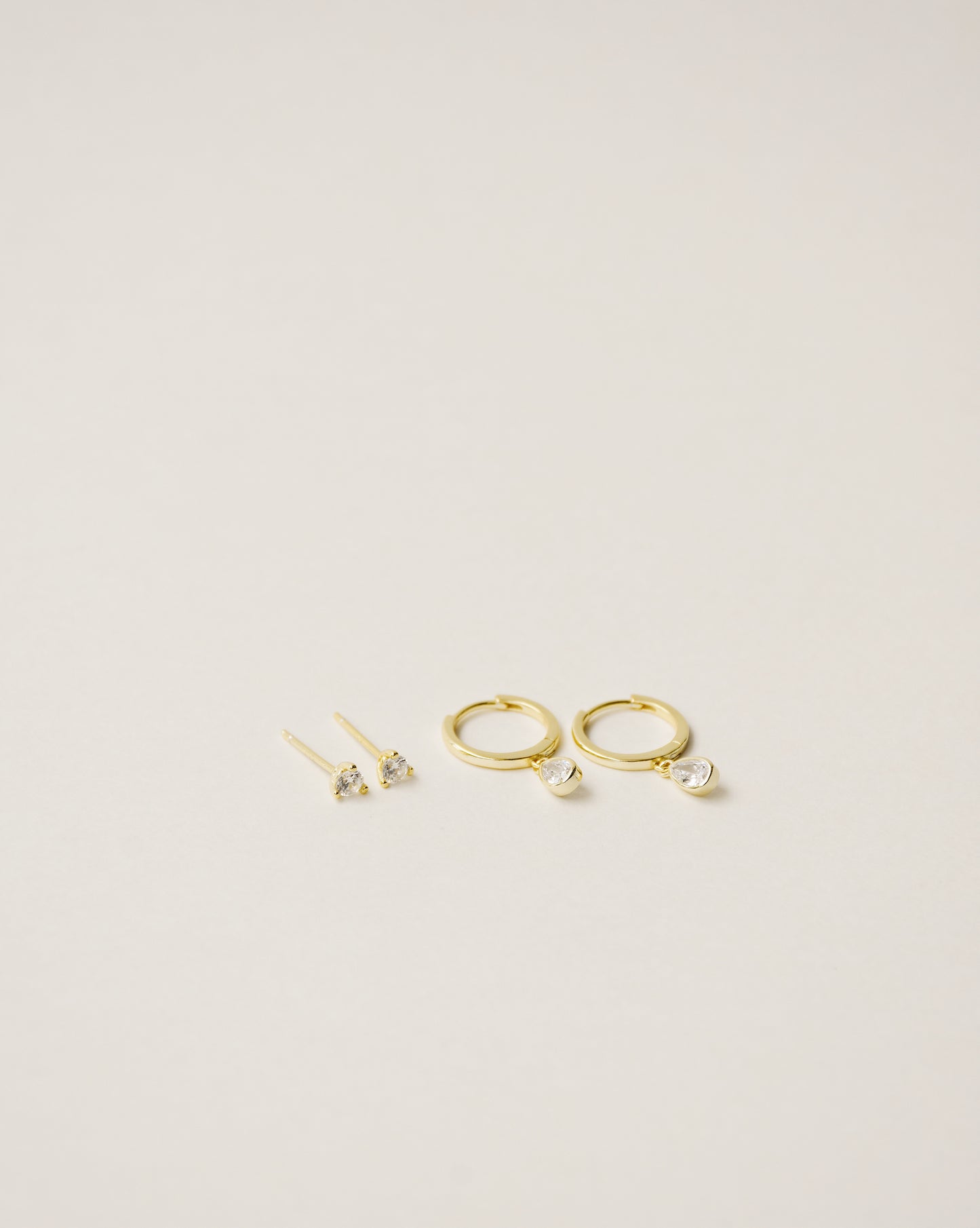 flawless and dainty white zirconia studs handcrafted from 925 sterling silver plated in 18k gold. 2020 slow fashion trend.