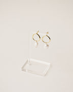 baroque freshwater pearl dangling from a irregularly shaped stud handcrafted from 925 sterling silver plated in 18k gold