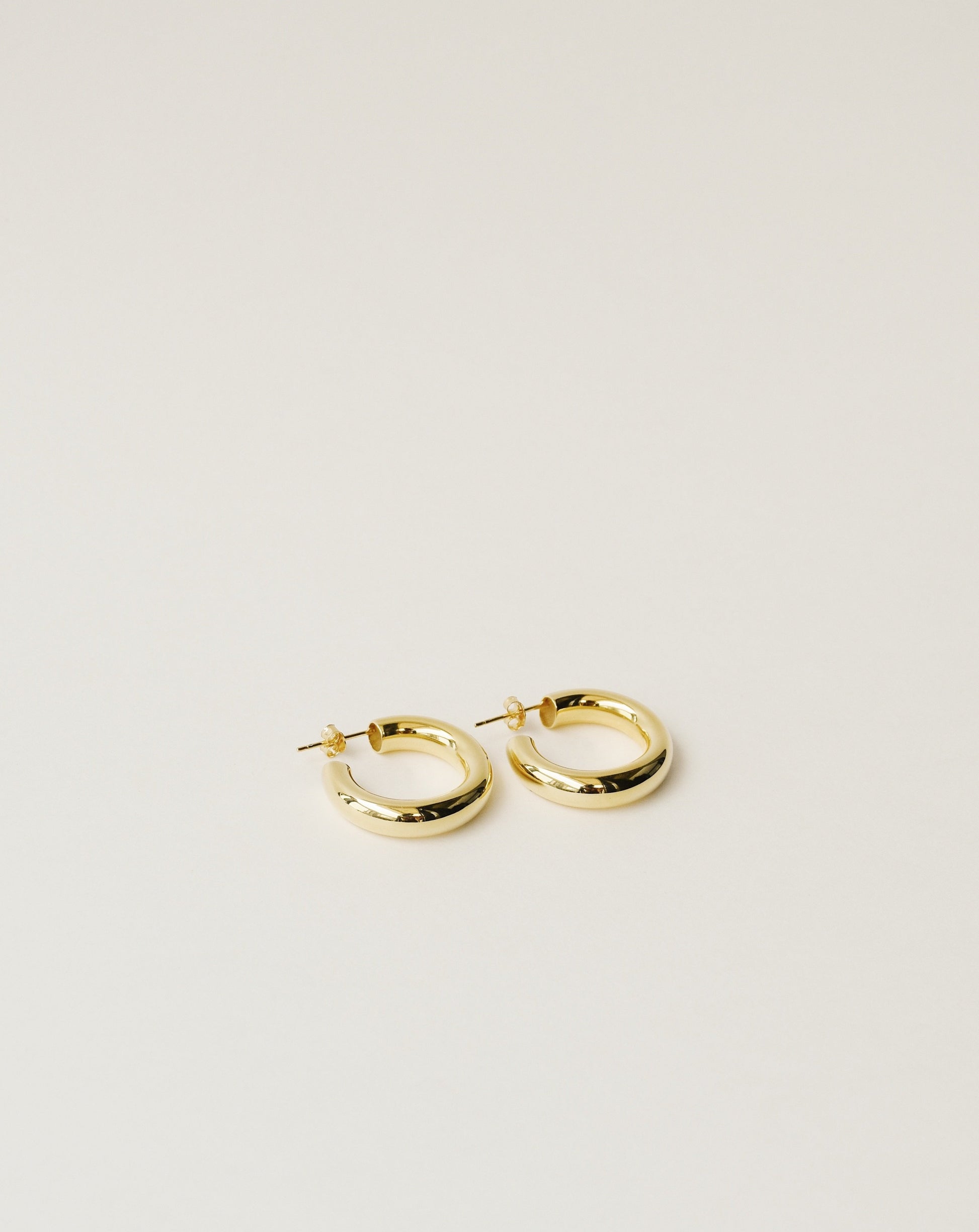 timeless and versatile maxi hoop earrings handcrafted from 925 sterling silver plated in 18k gold. hollow and lightweight. 2020 slow fashion trend.