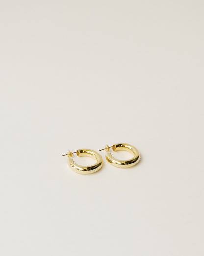 timeless and versatile maxi hoop earrings handcrafted from 925 sterling silver plated in 18k gold. hollow and lightweight. 2020 slow fashion trend.
