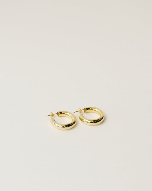 timeless and versatile maxi hoop earrings handcrafted from 925 sterling silver plated in 18k gold. hollow and lightweight. 2020 slow fashion trend.