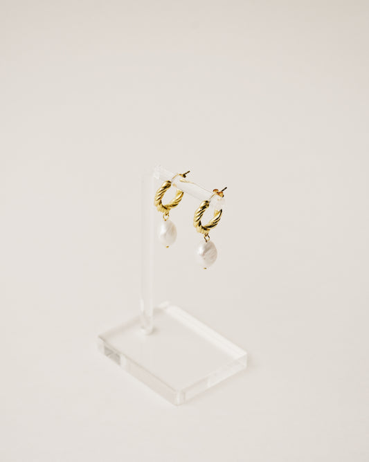 baroque freshwater pearl dangling from a twisted mini hoop handcrafted from 925 sterling silver plated in 18k gold. 2020 slow fashion trend.