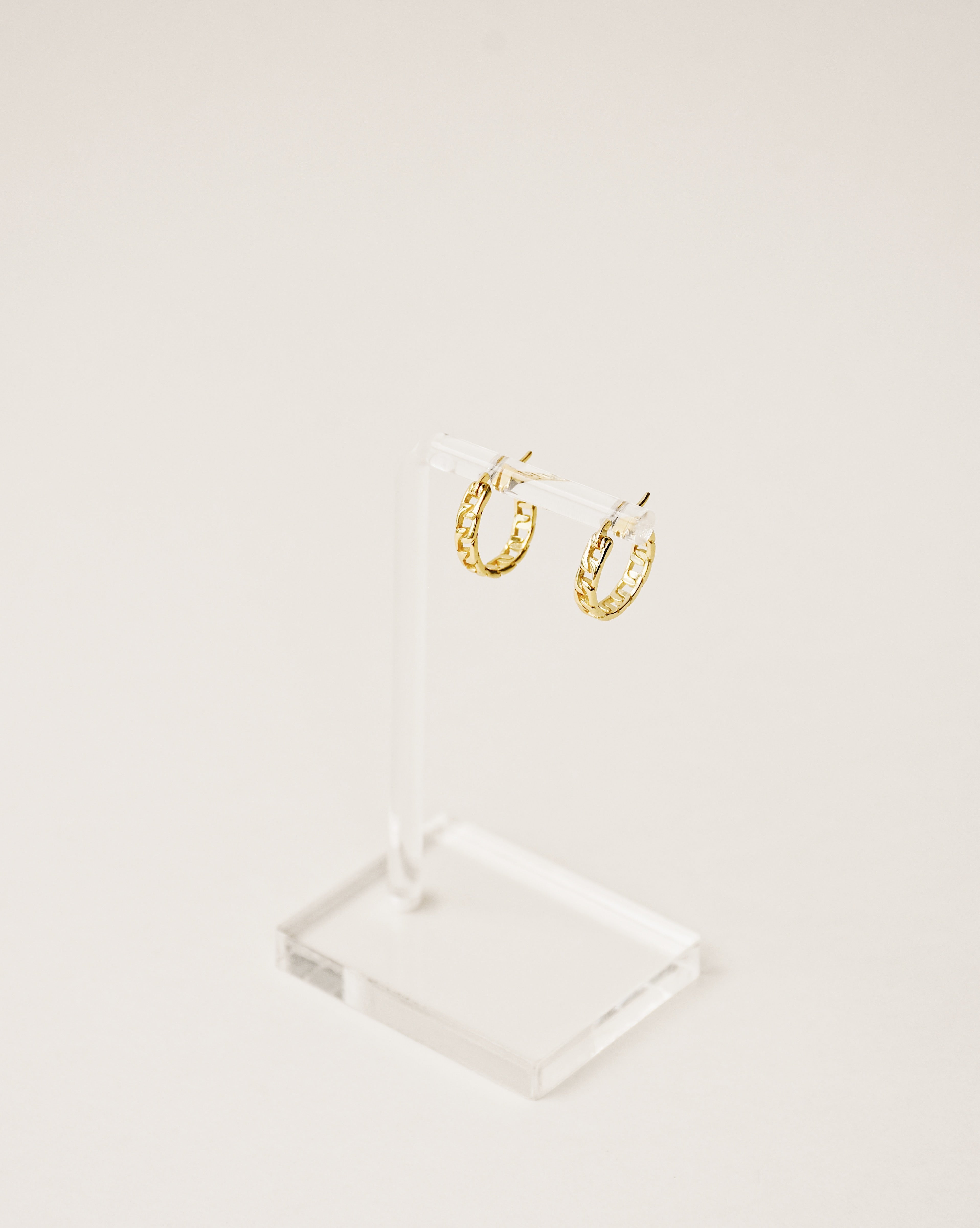 chain shape mini hoop earrings handcrafted from 925 sterling silver plated in 18k gold. 2020 slow fashion trend.