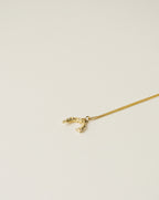 irregularly shaped pendant necklace handcrafted from 925 sterling silver plated in 18k gold. 2020 slow fashion trend.