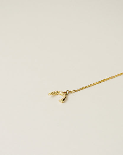 irregularly shaped pendant necklace handcrafted from 925 sterling silver plated in 18k gold. 2020 slow fashion trend.