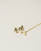 irregularly shaped stud earrings and necklace handcrafted from 925 sterling silver plated in 18k gold. 2020 slow fashion trend.