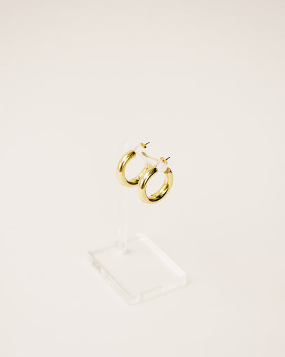 timeless and versatile maxi hoop earrings handcrafted from 925 sterling silver plated in 18k gold. hollow and lightweight. 2020 slow fashion trend.