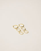 set of three stackable mini hoop earrings handcrafted from 925 sterling silver plated in 18k gold. 2020 slow fashion trend.