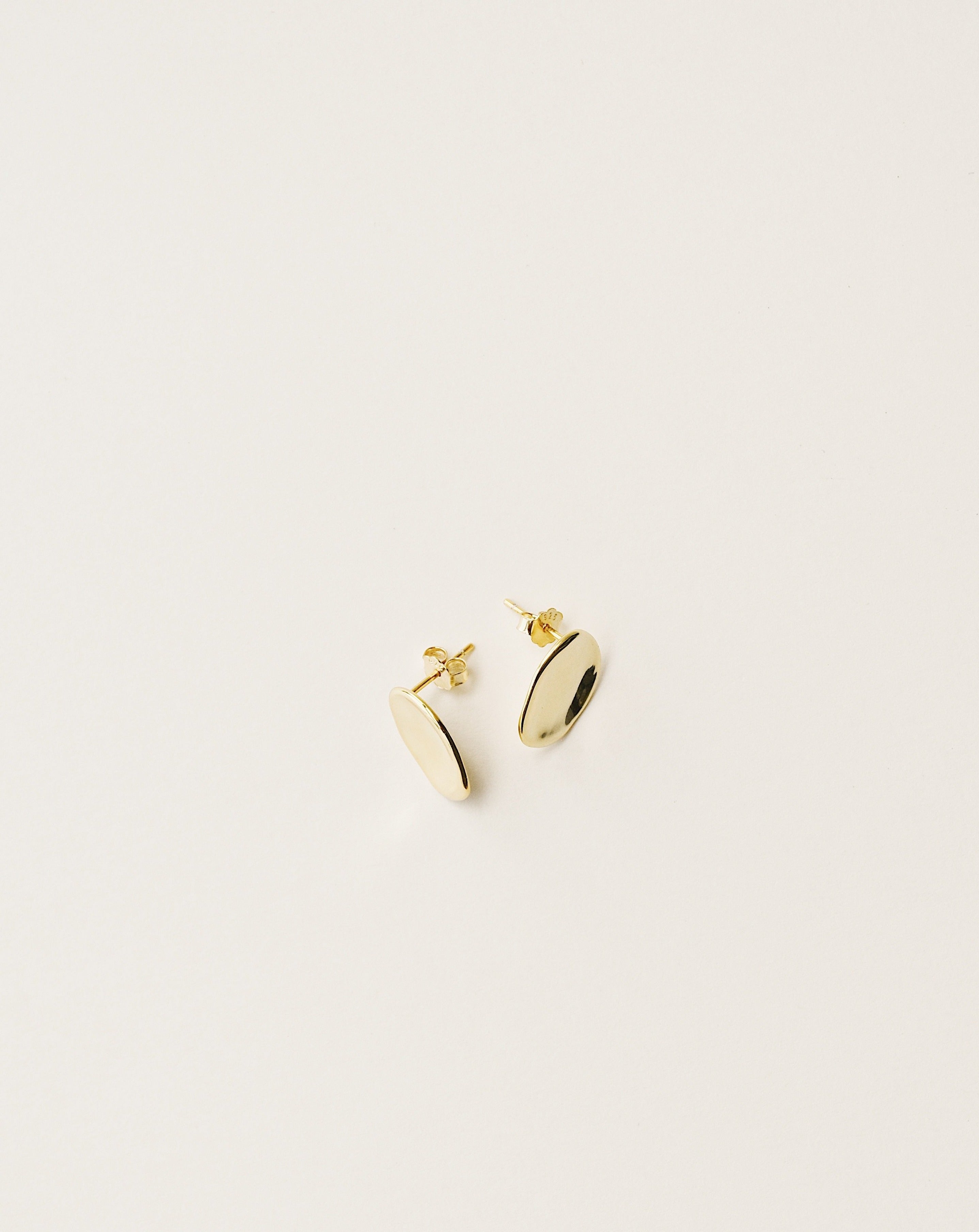 irregularly shaped stud earrings handcrafted from 925 sterling silver plated in 18k gold. 2020 slow fashion trend.