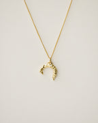 irregularly shaped pendant necklace handcrafted from 925 sterling silver plated in 18k gold. 2020 slow fashion trend.