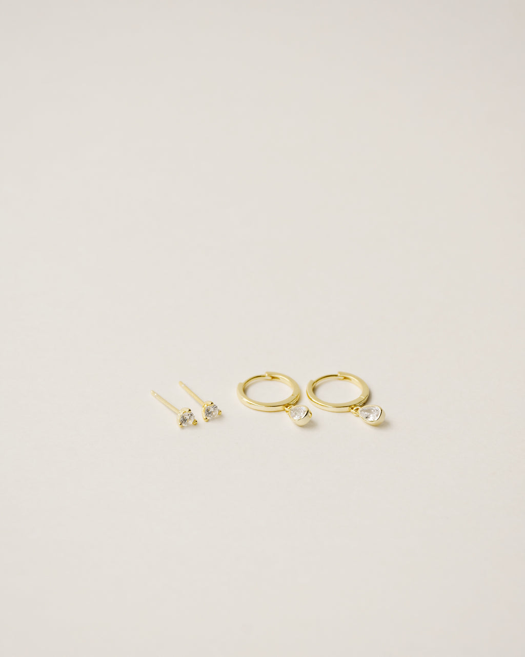 flawless and dainty white zirconia studs handcrafted from 925 sterling silver plated in 18k gold. 2020 slow fashion trend.