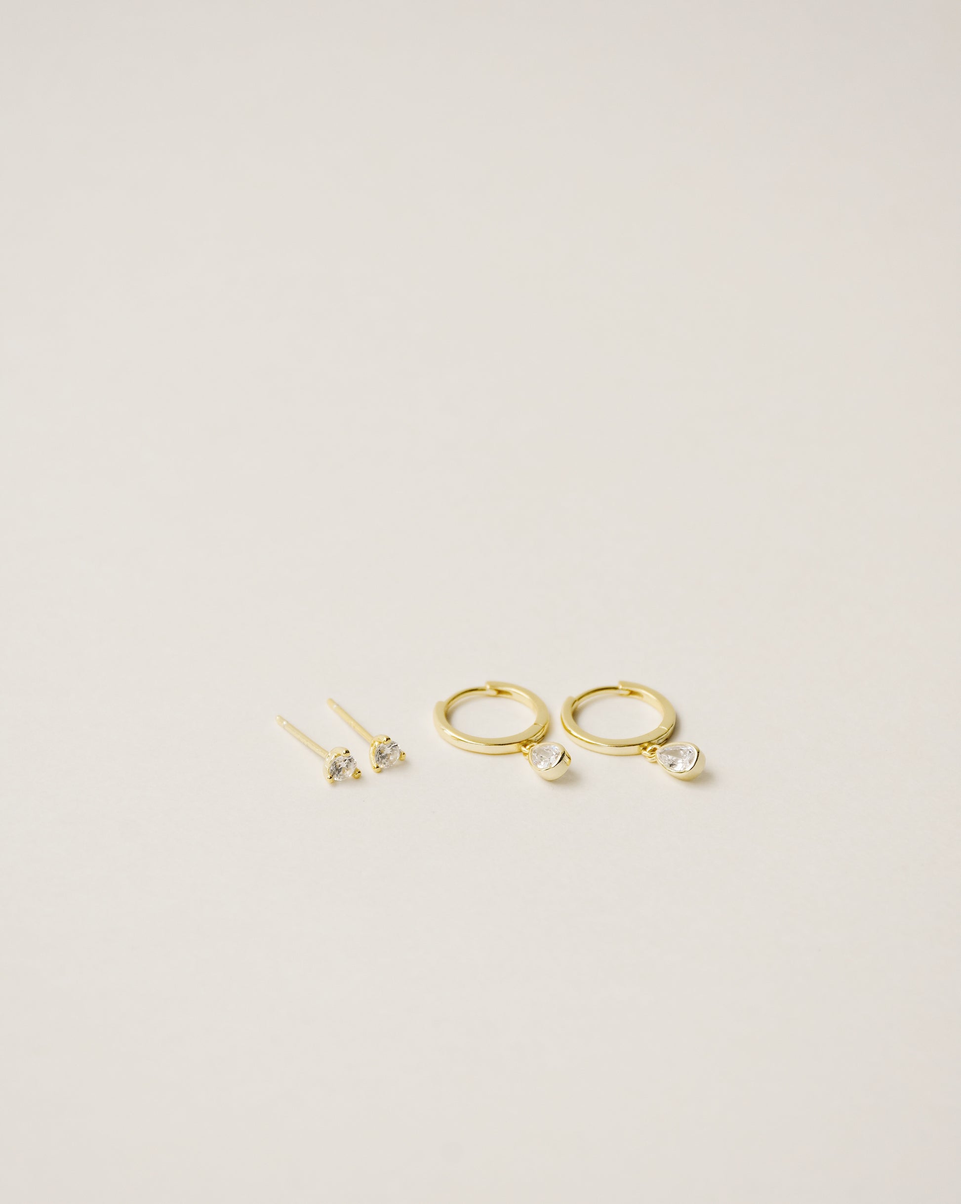 flawless and dainty white zirconia studs handcrafted from 925 sterling silver plated in 18k gold. 2020 slow fashion trend.