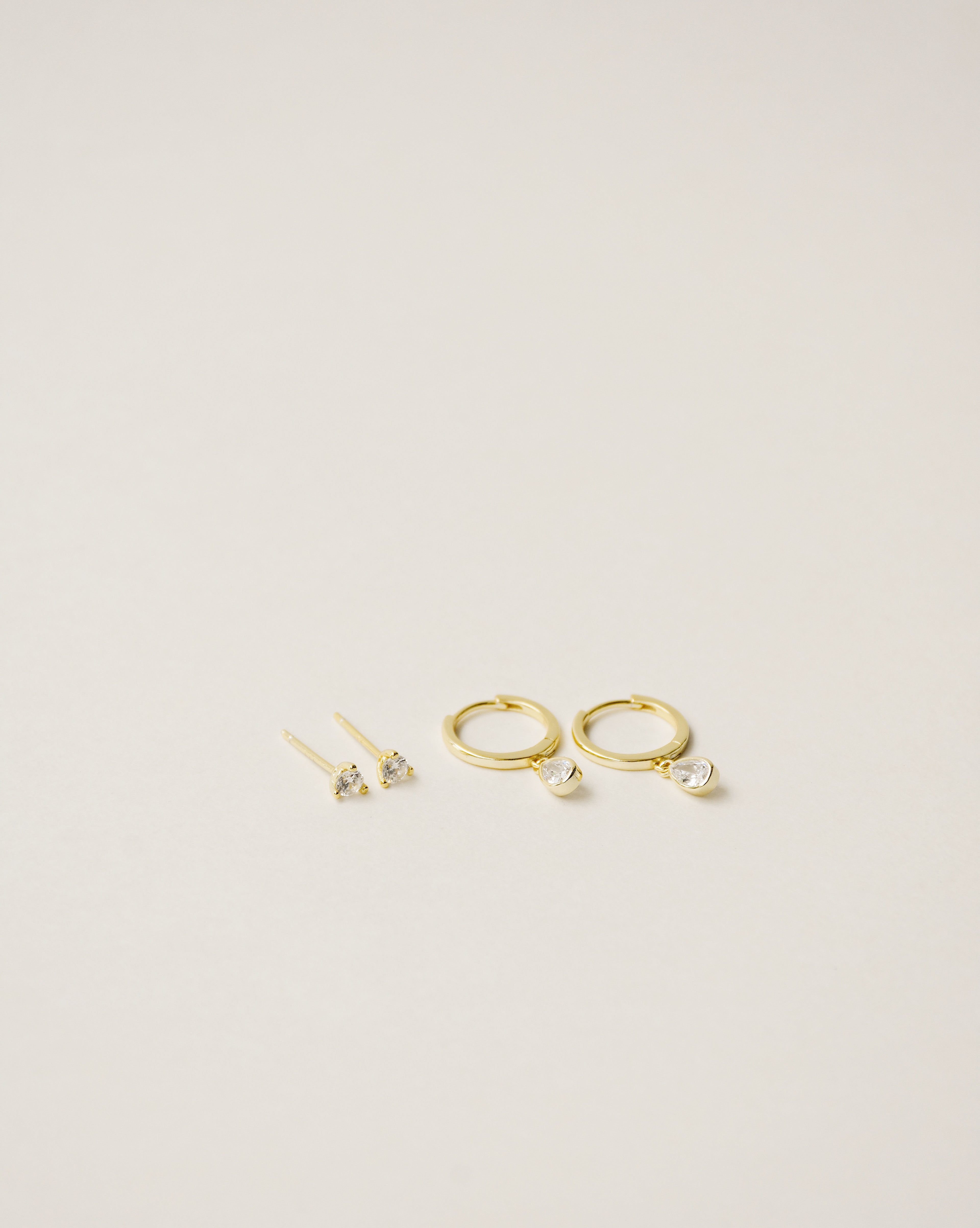 flawless and dainty white zirconia studs handcrafted from 925 sterling silver plated in 18k gold. 2020 slow fashion trend.